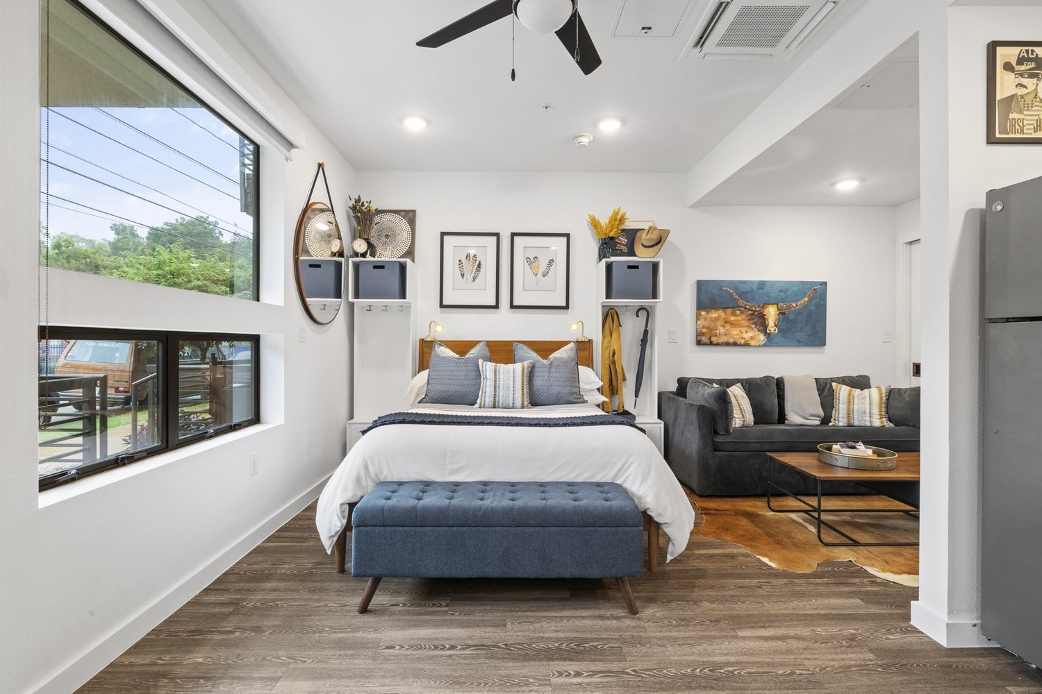 A bright Holly House studio with a bed, lounge area, and kitchenette